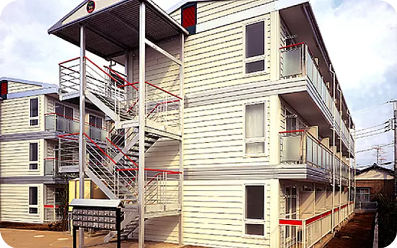 French-colored building is accented with red railings